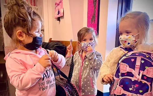 a group of children with face paint