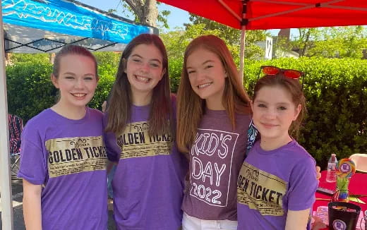 a group of girls posing for a photo