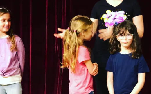 a group of girls with flowers in their hair