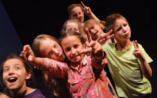 a group of children posing for a photo