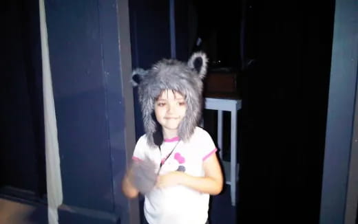 a girl wearing a furry hat