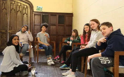 a group of people sitting in chairs