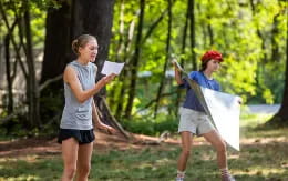 a man and woman holding papers