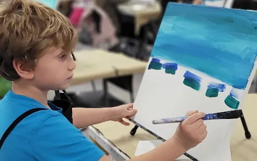 a young boy painting