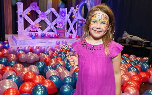 a girl holding a ball