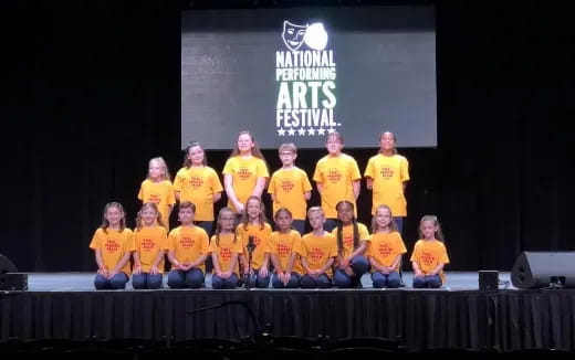 a group of people wearing yellow shirts