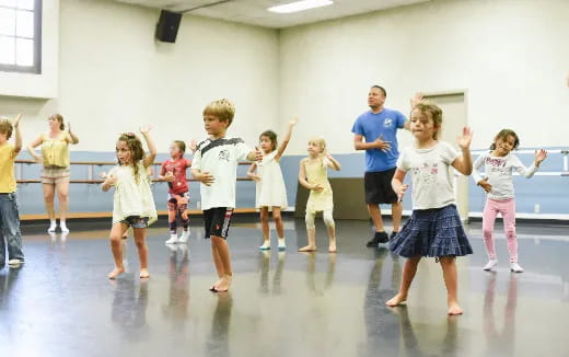a group of children dancing