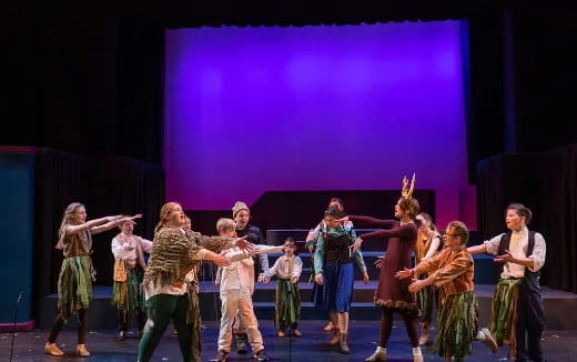 a group of people dancing on a stage