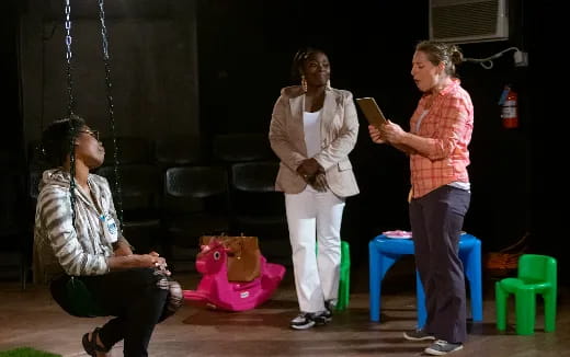 a group of women standing in a room