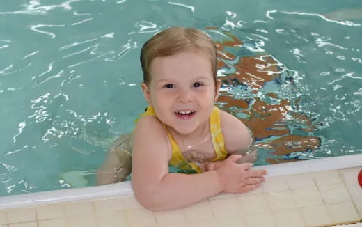 a baby in a pool