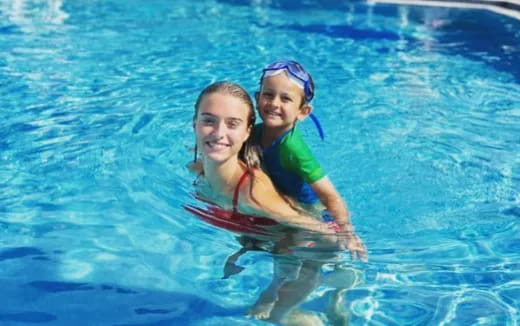 a couple of girls in a pool