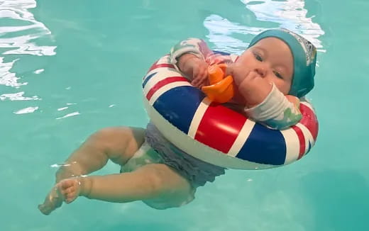 a baby in a pool