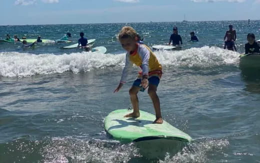 a girl on a surfboard in the ocean