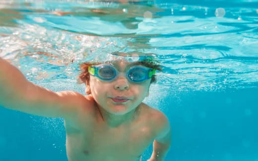 a person swimming in a pool