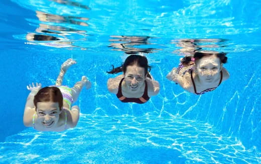 a group of people swimming