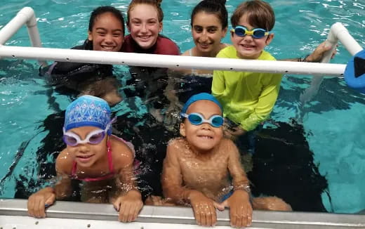 a group of kids in a pool