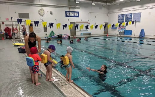 a group of people in a pool