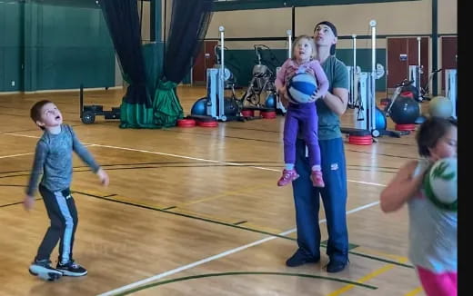 a group of kids in a gym