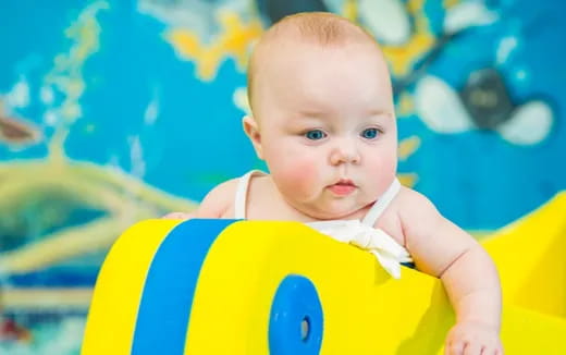 a baby in a pool