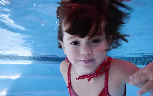 a child in a pool