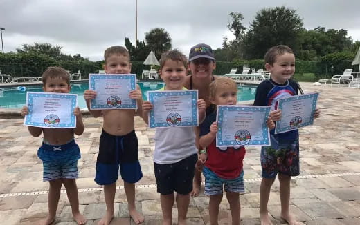a group of children holding signs