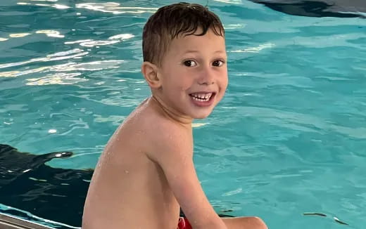 a boy in a pool