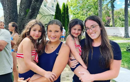 a group of women posing for a photo