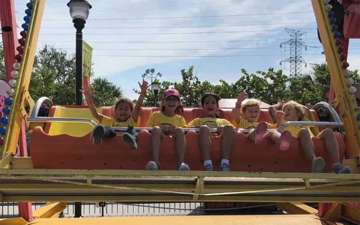 a group of kids on a roller coaster