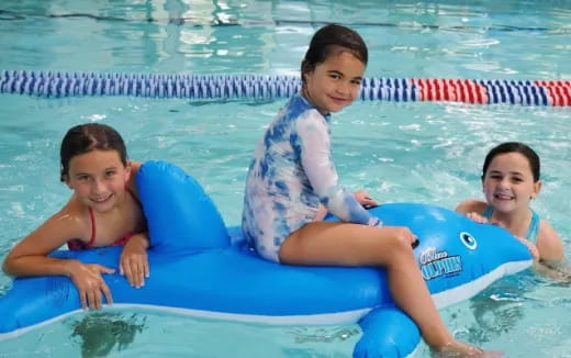 a group of girls in a pool