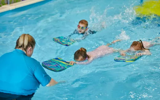 a group of people in a pool