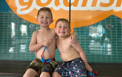 two boys in swimsuits