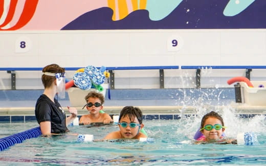 a group of people in a pool