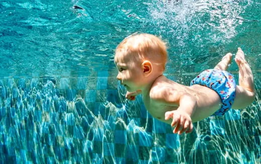 a baby in a pool