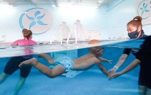 a group of people in a swimming pool