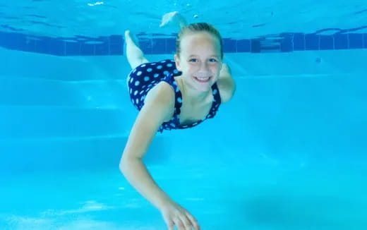 a boy in a pool