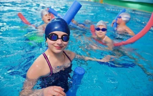 a group of people in a pool