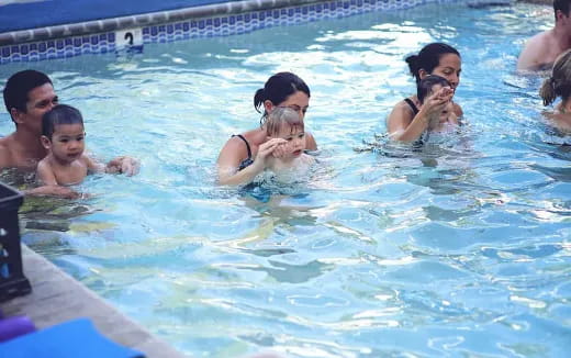 a group of people in a pool