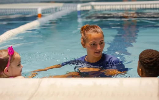 a boy and a girl in a pool