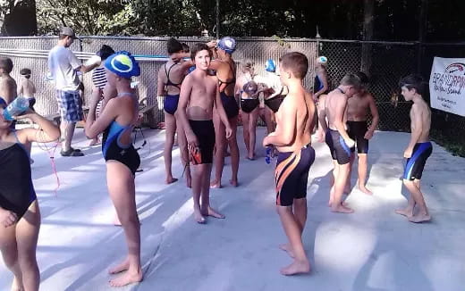a group of people playing volleyball