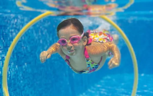 a baby in a pool