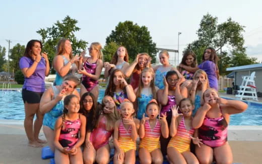 a group of women posing for a photo