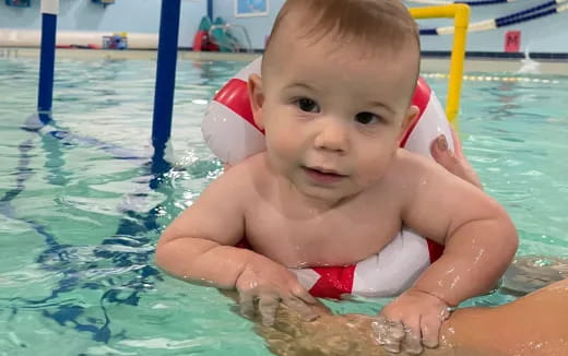 a baby in a pool