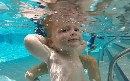 a baby in a pool