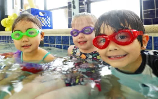a group of kids in a pool