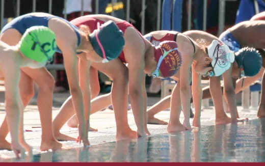 a group of people in a pool