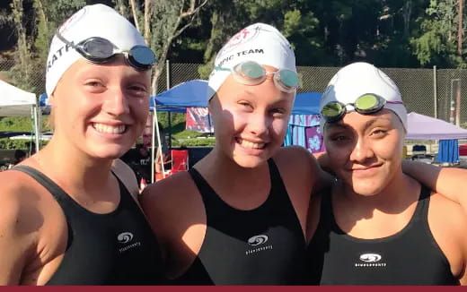 a group of people posing for the camera