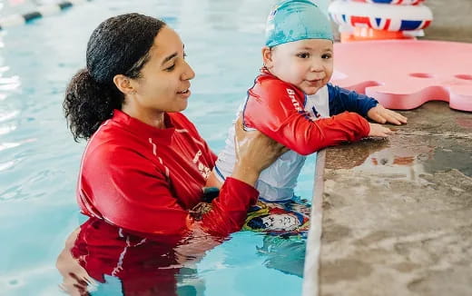 a person and a child in a pool