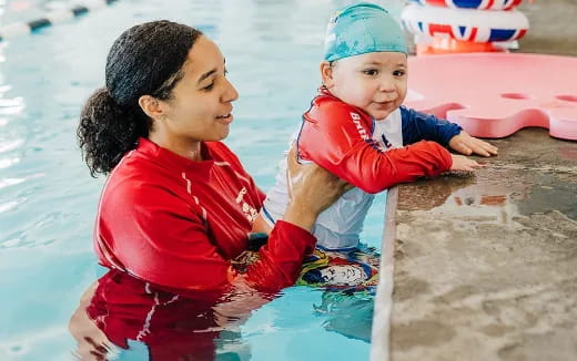 a person and a child in a pool