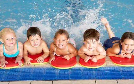 a group of kids in a pool