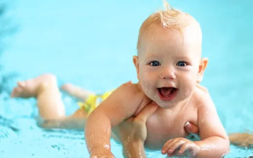 a baby in a pool